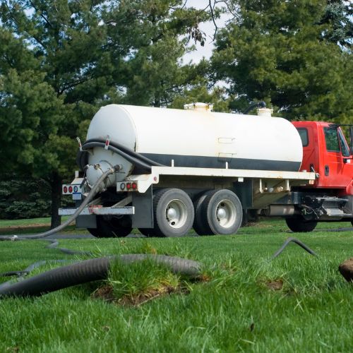 Professional septic tank pumping service in progress by Champion Septic Tank.